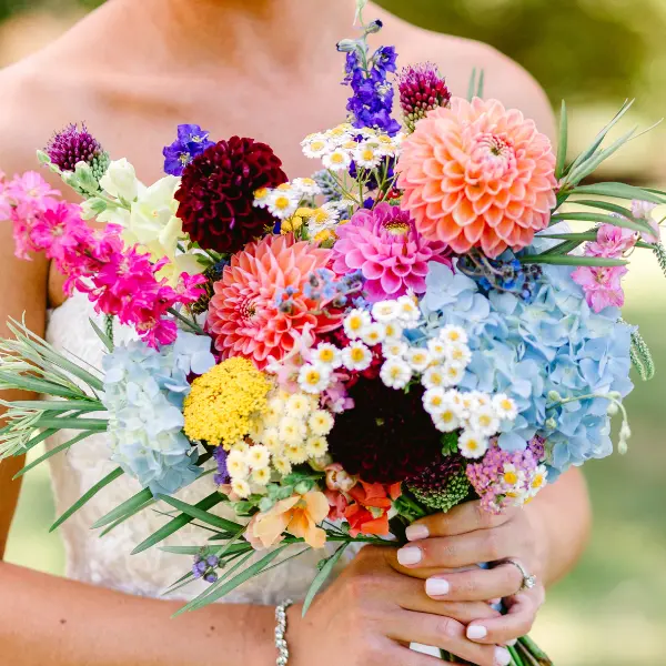 A bright purple, pink, coral and blue bouquet up close