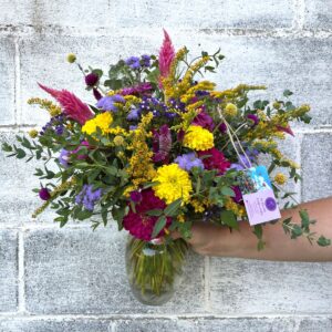 Bright summer flowers in a vase arrangement.