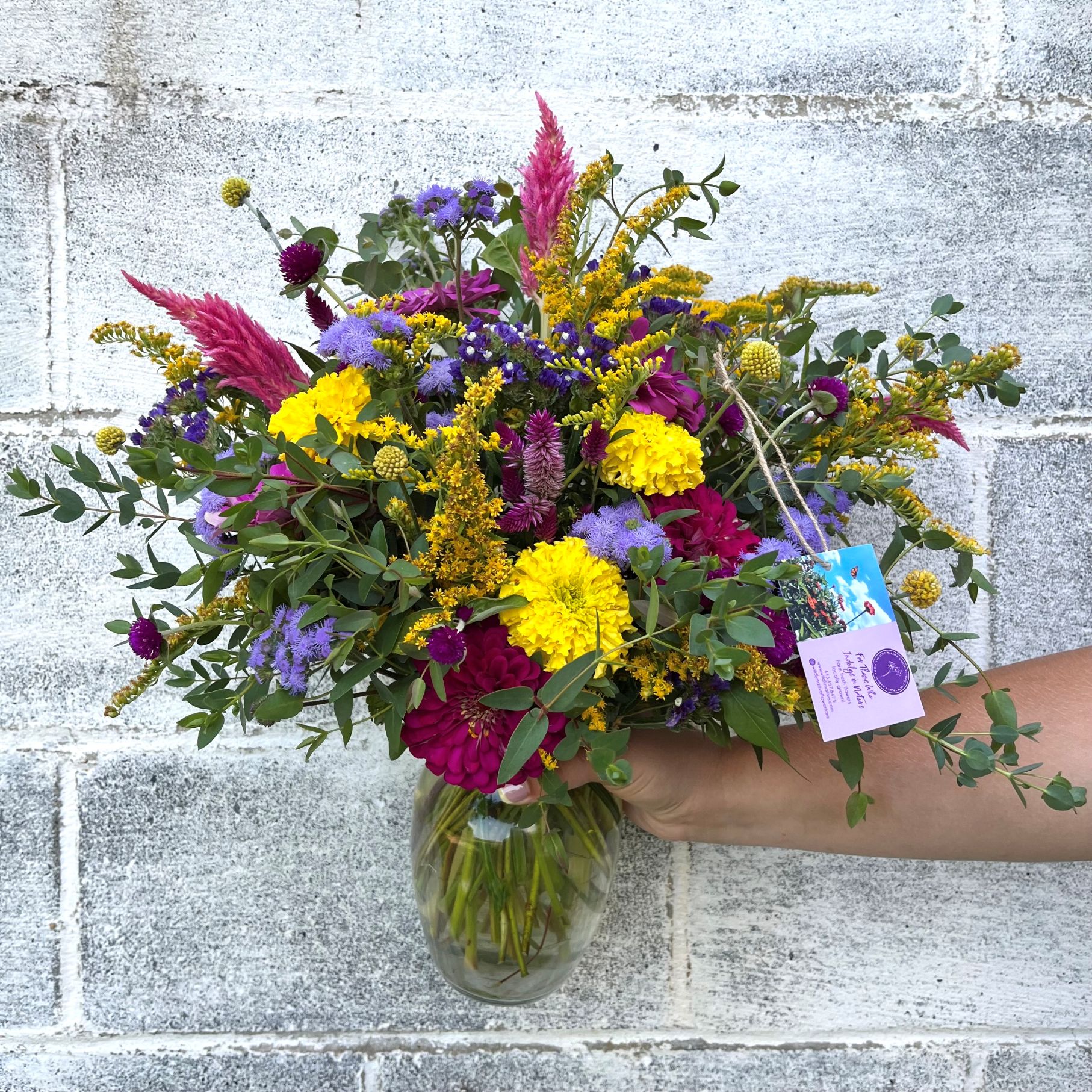 Bright summer flowers in a vase arrangement.