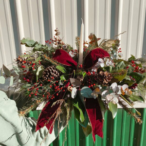 Holiday Christmas Table floral arrangement with taper candle and bow