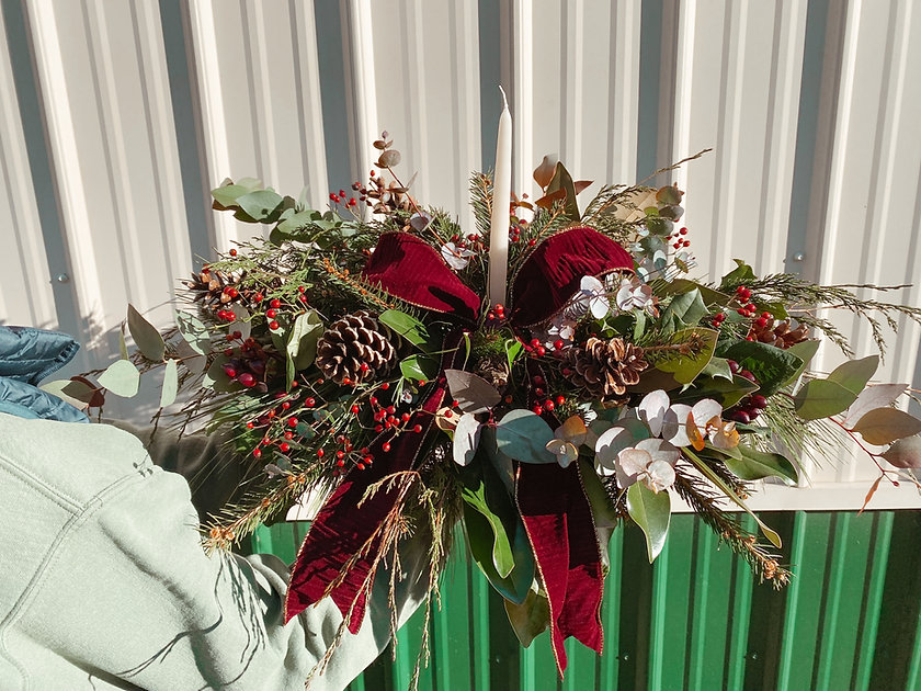 Holiday Christmas Table floral arrangement with taper candle and bow