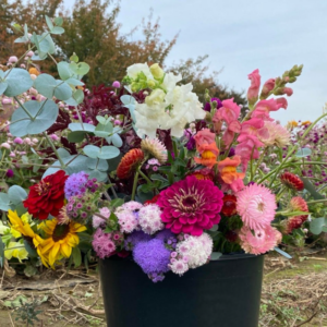 Bucket full of diy cut flowers.
