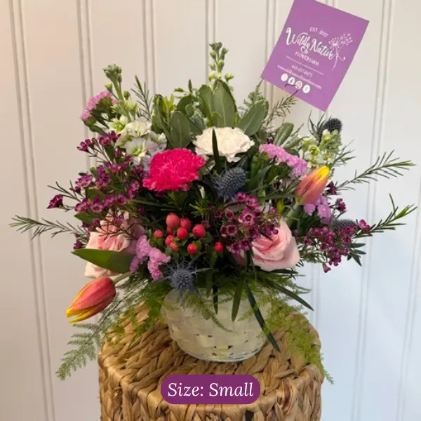 Small colorful sympathy basket arrangement
