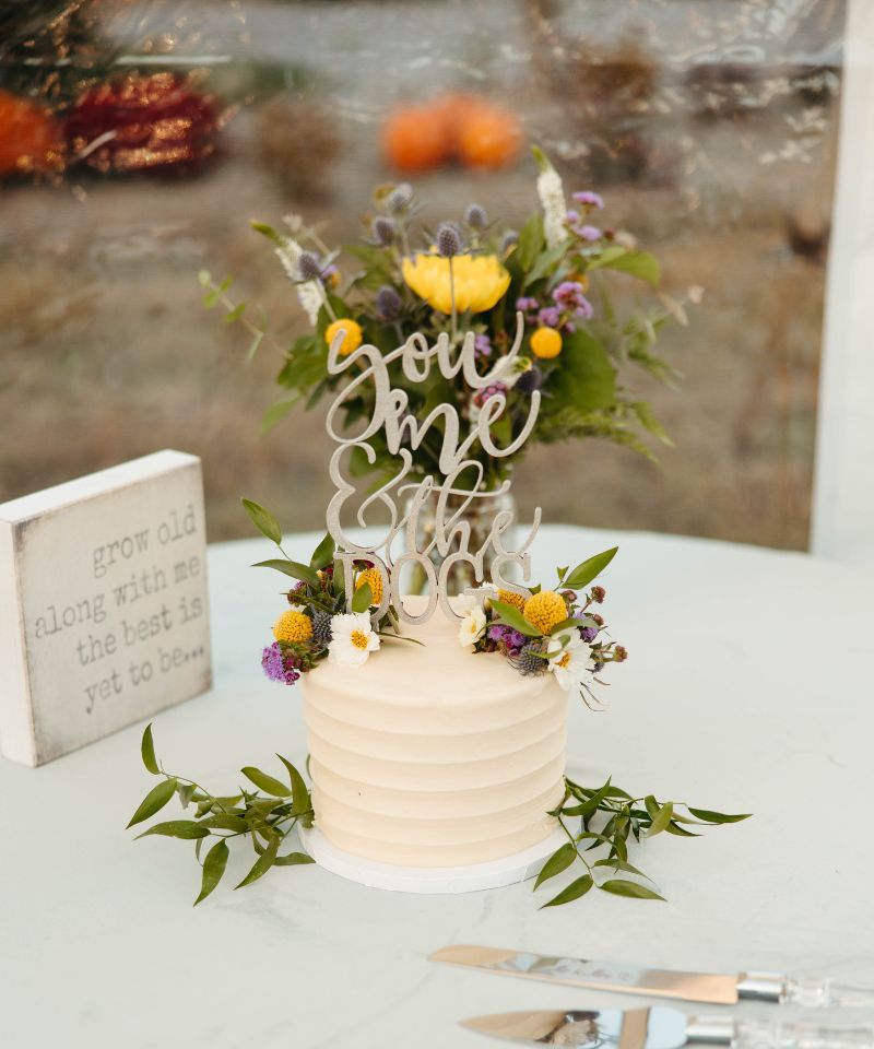 wedding cake with blue and gold flowers
