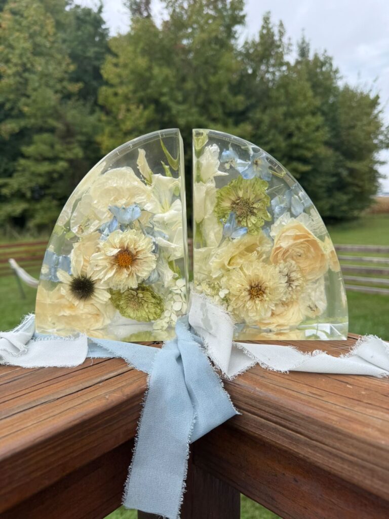 Preserved flower bookends in resin from blue and white wedding flowers.