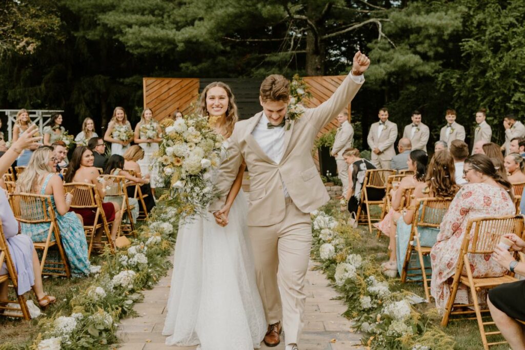 isle decor with flowers down the edge of the isle