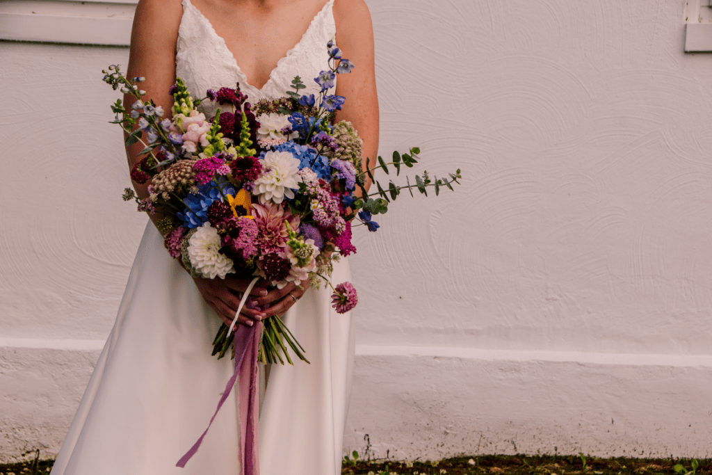 organic shaped bridal bouquet with dark and moody colors