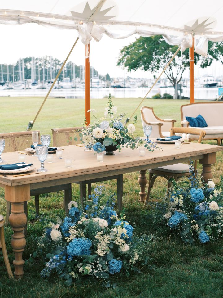 blue and white flowers with repurposed flowers from the ceremony