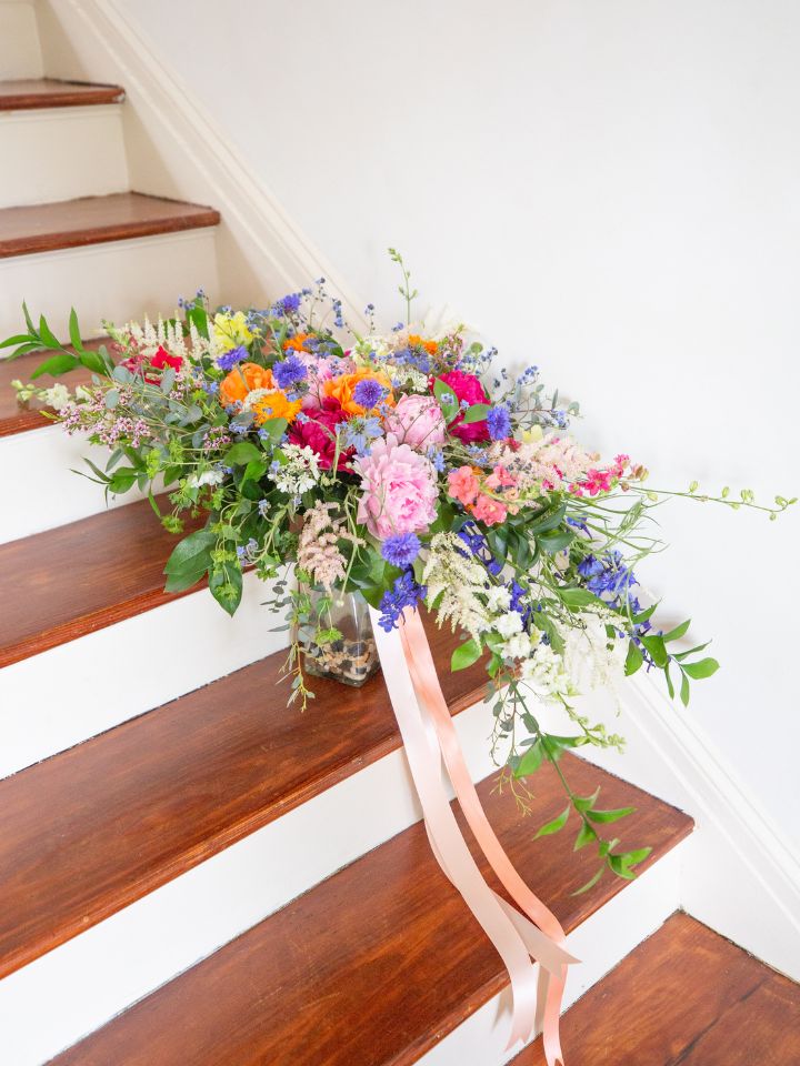 cascading wedding bouquet with ribbon and wildflowers