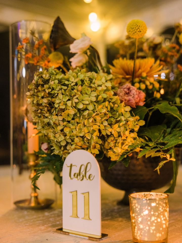 centerpiece with compote filled with fall flowers