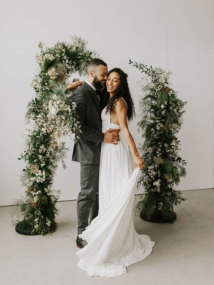 floating arch with greenery and white flower textures