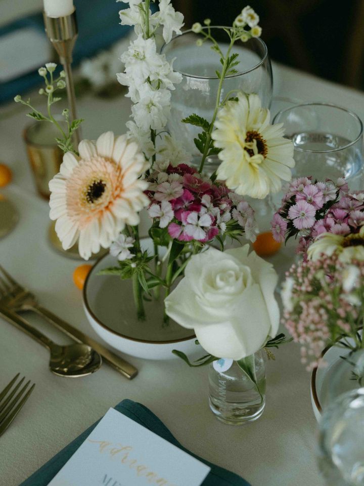 spring flowers in frogs with reception tables