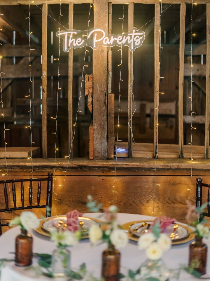 sweetheart table with light and bud vases