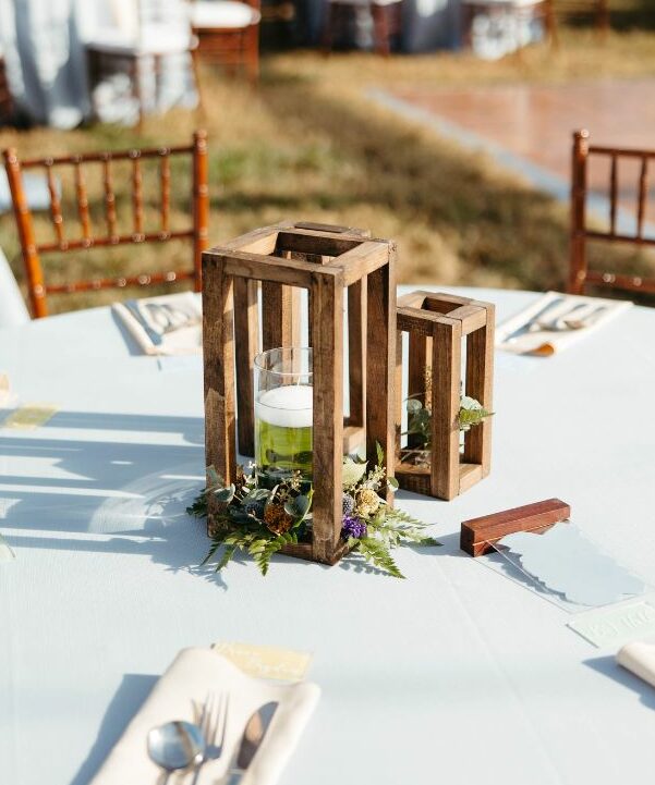 centerpiece greens with candles and greenery