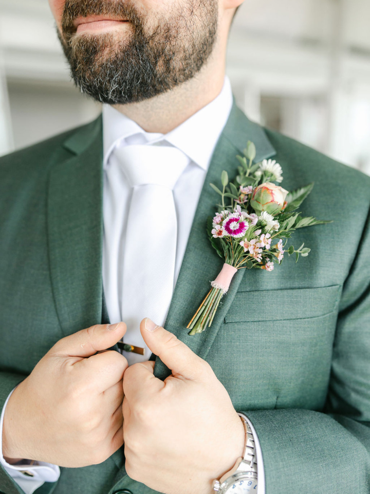 Flower Boutonniere on a dark green suit