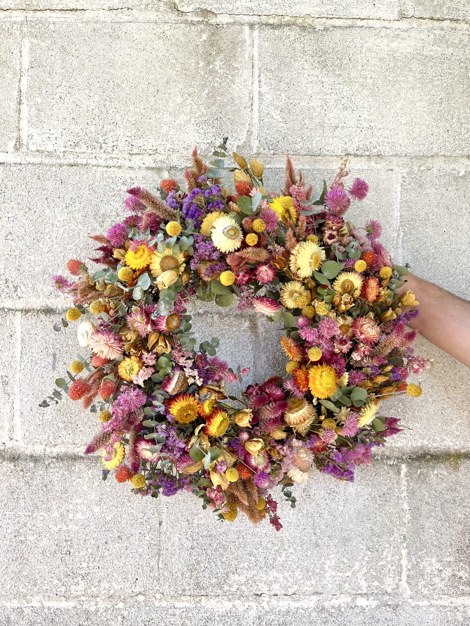 Bright and colorful dried flower wildflower wreath.