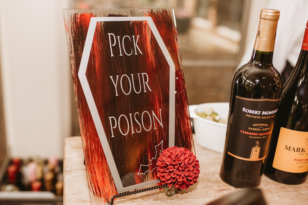 Paddack Pick Your Poison Drink sign at a wedding bar says Pick Your Poison.