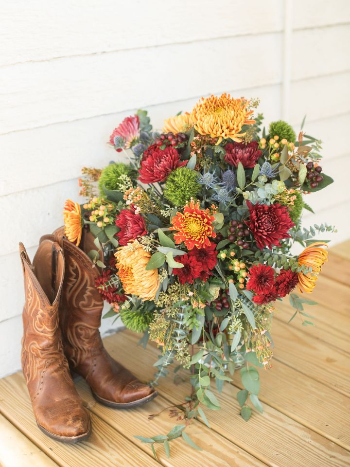 Autumn Wedding Flowers Bridal Bouquet next to brown cowboy boots