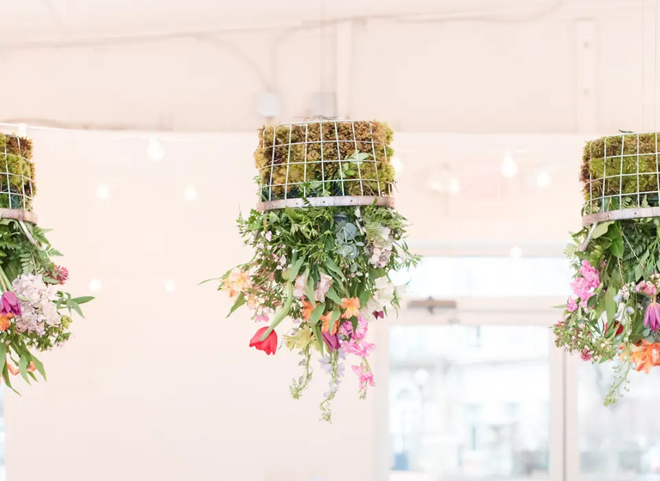 Prism Annapolis Styled Shoot with Flower Baskets Hanging upside down from the ceiling