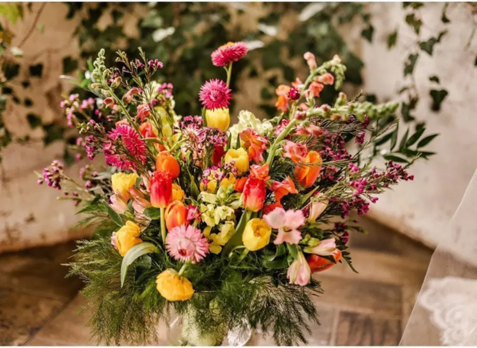 Up close view of a bright and wild bouquet for a wedding by wildly native flower farm
