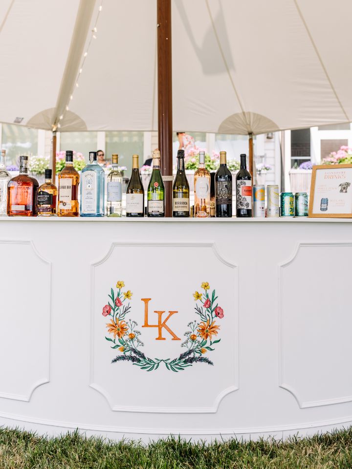 White circular bar with floral monogram.