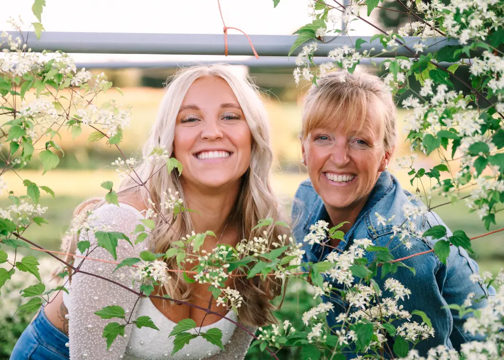 Lizzy and Liza smiling at the camera