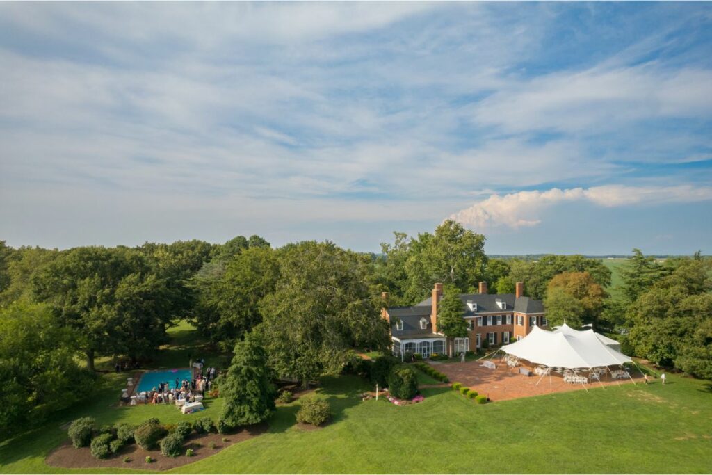 Kayla Brittland Estates An overhead drone picture of Brittland Estates with a white tent set up.