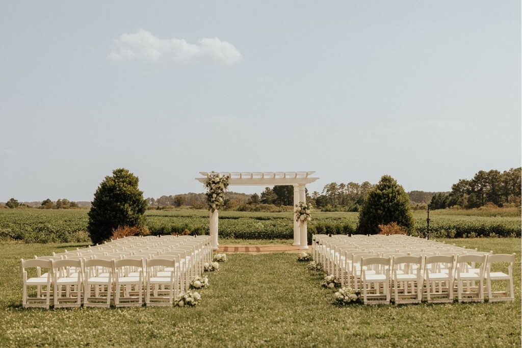 Kent Island Resort Pergola The large white pergola decorated in wedding flowers from Wildly Native Flower Farm as the Kent Island Resort Florist