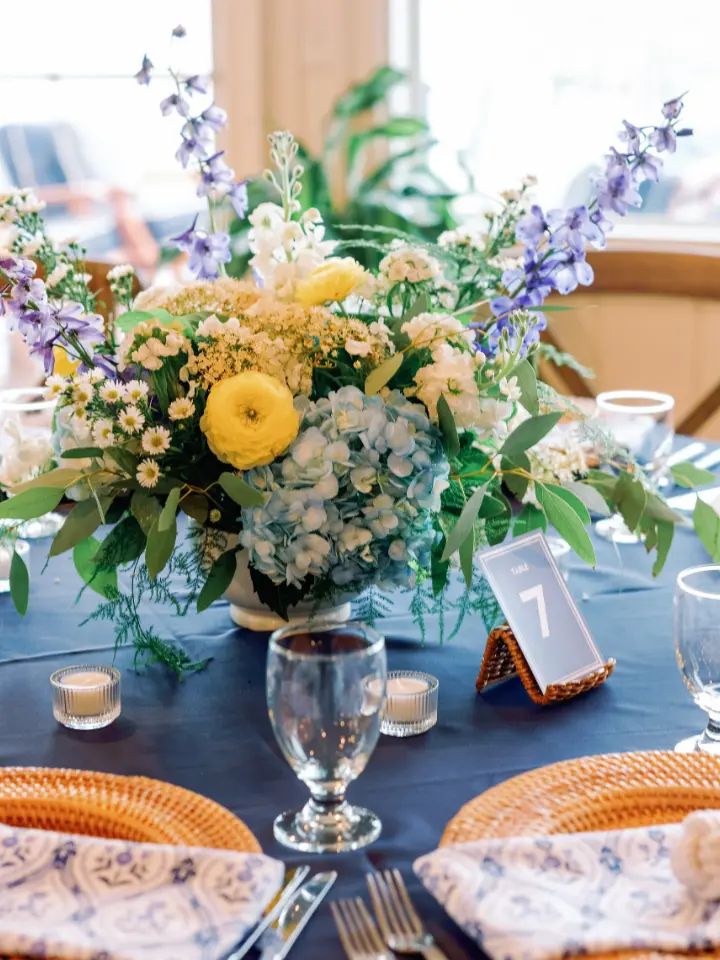 springbluewhite_wylderhotel1 Up close of the reception table floral design: yellow, white and blue florals