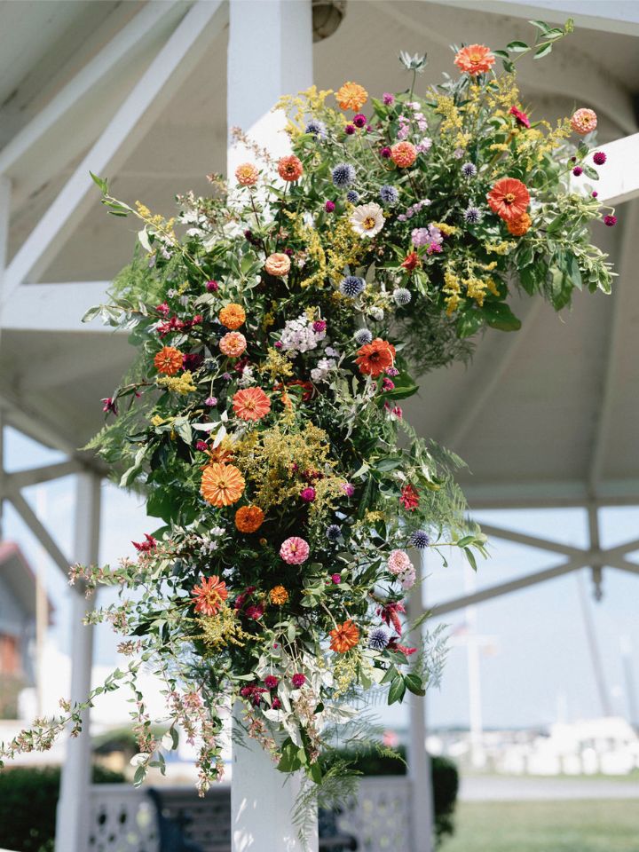 Detail of wedding ceremony flowers in bright summer colors for a summer eastern shore wedding.