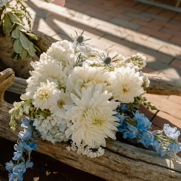 Up close of blue and white florals on a fall ceremony