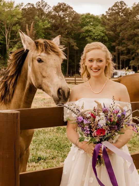 bridesmilingwithhorse bride smiling with a horse<br />