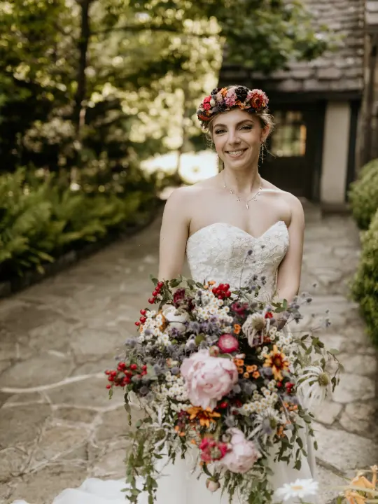 bridewithfloralcrown Bride smiling at camera wearing a floral crown