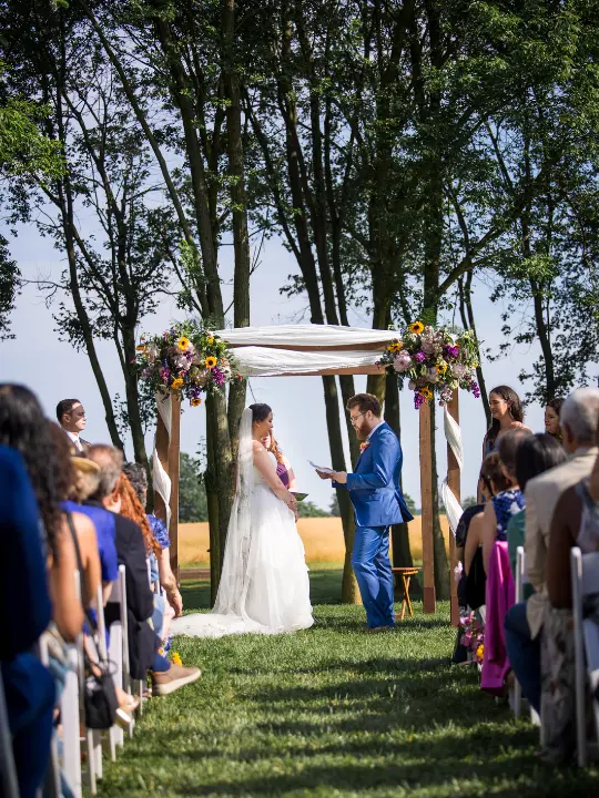floralchuppah Bright flowers on chuppah with fabric