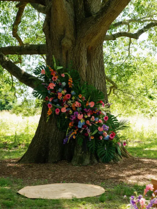floraltreeinstallation Floral installation on a tree for a wedding ceremony by Wildly Native Flower Farm