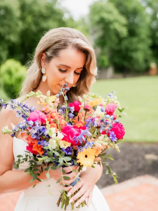 kentislandresortwedding1 Bride looking down at her bouquet