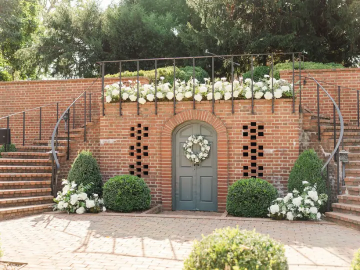 onsiteinstallationonbrick On site ceremony floral installation by Wildly Native Flower Farm