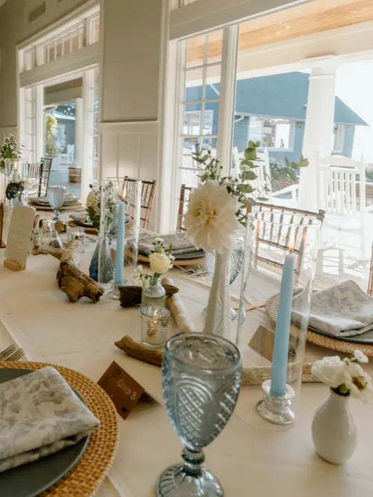 scatteredvaseswithbluetaperedcandles Scattered vases with blue tapered candles