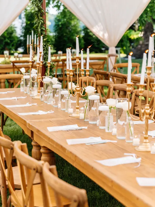 scatteredvaseswithcandelabras Scattered vases with white flowers and brass candelabras