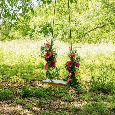 Florals on a swing during a wedding reception