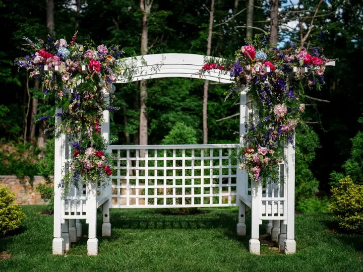 whitearchpurplepinkflorals White Arch decorated with arch florals in purple, pink, and more