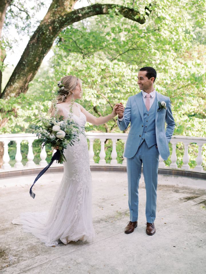 Bride and groom spin on a patio