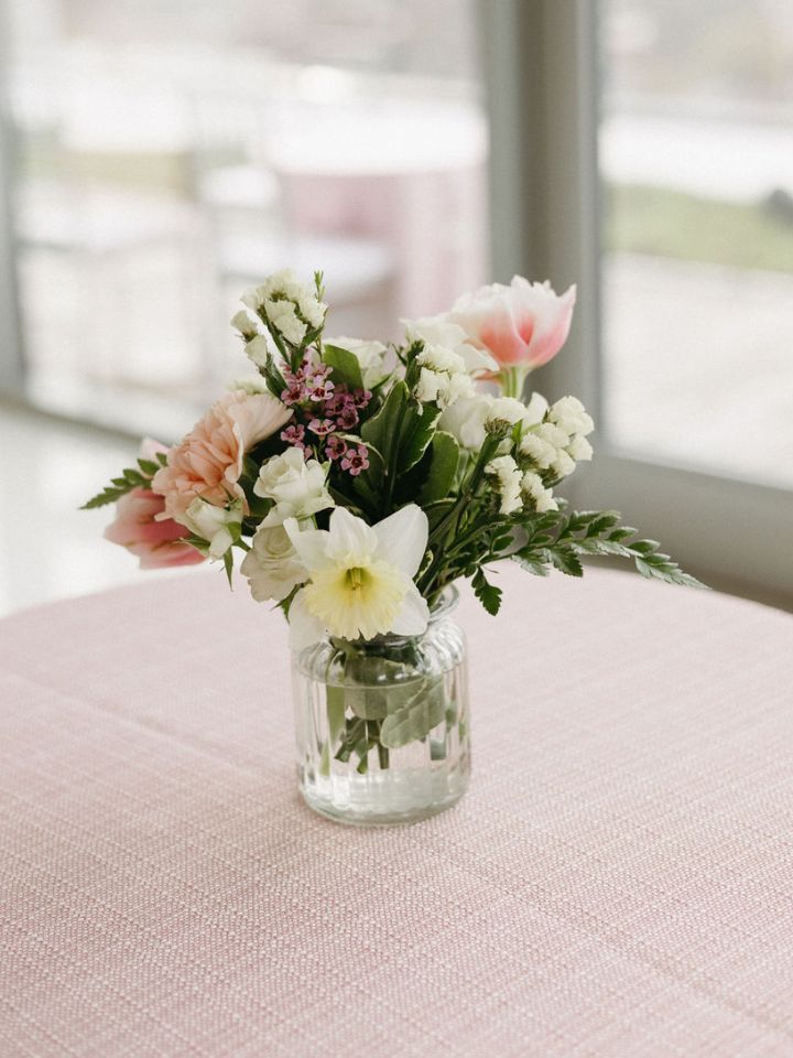 WN Portrait Image Size 720x960 (1) Cocktail table vase with spring pastel flowers and daffodils.