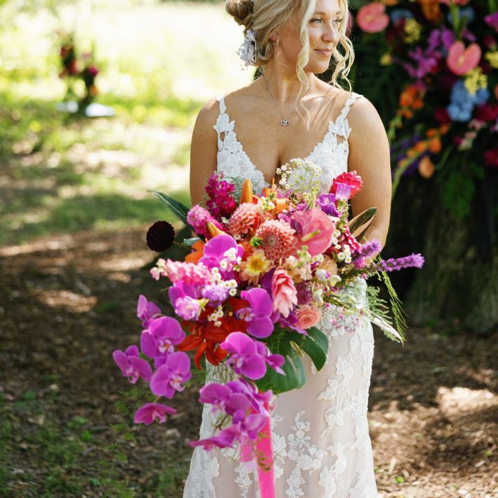 cascading sq Lizzy holds colorful cascading bouquet