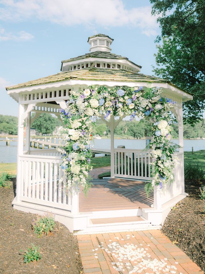 White gazebo at Kent Island Resort with heavy blue and white florals.