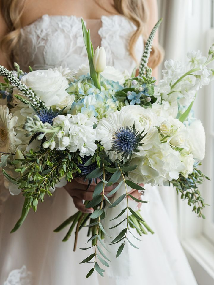 jacqueline classic organic Closeup of blue and white bridal bouquet in an organic shape.