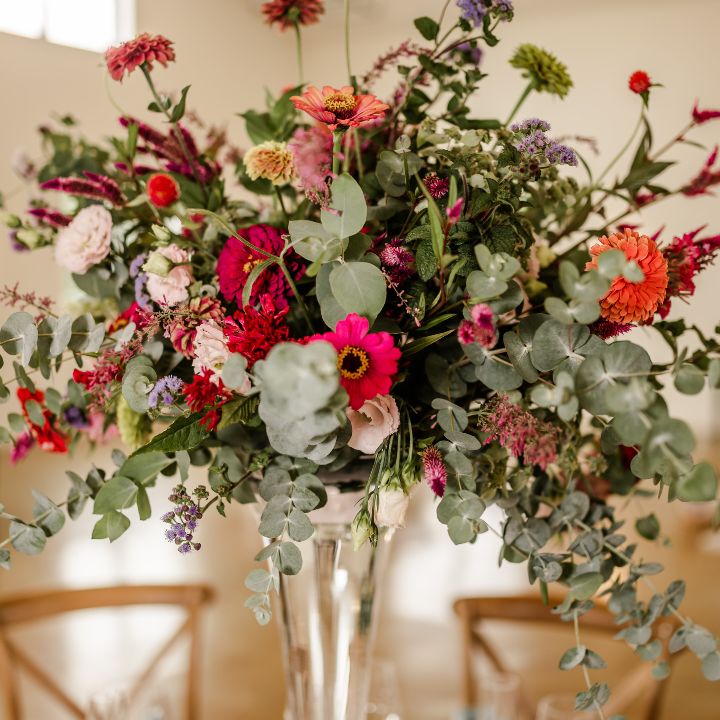 pedestal with zinnias