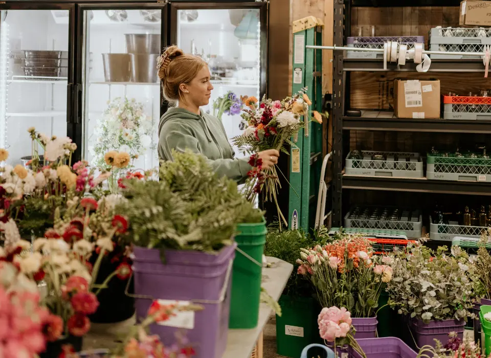 shop-seasonal-flowers Lizzy creating an arrangement in the shop