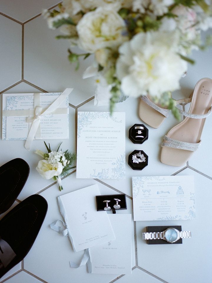 Wedding invitation and floral flatlay with white and black.