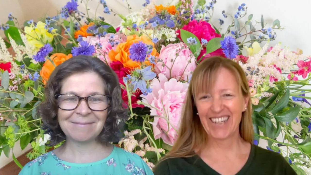 Ellen Frost and Liza in front of florals